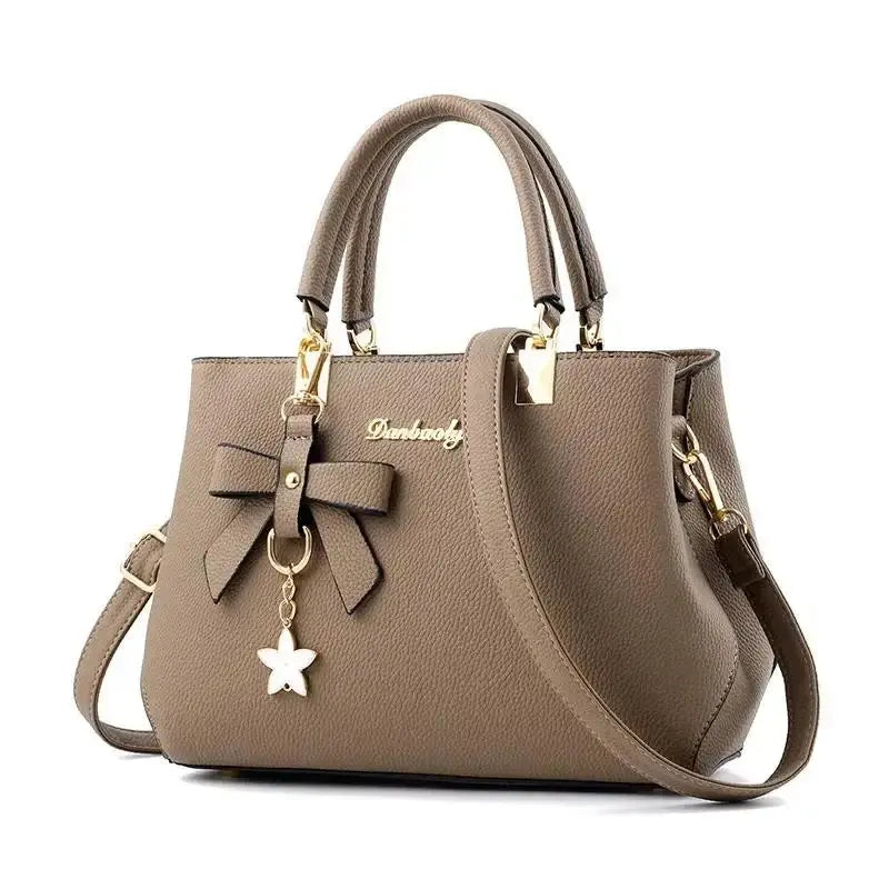 Elegant women's shoulder bag with flower pendant MAWIS
