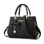 Elegant women's shoulder bag with flower pendant MAWIS