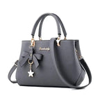 Elegant women's shoulder bag with flower pendant MAWIS