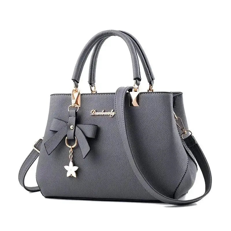 Elegant women's shoulder bag with flower pendant MAWIS