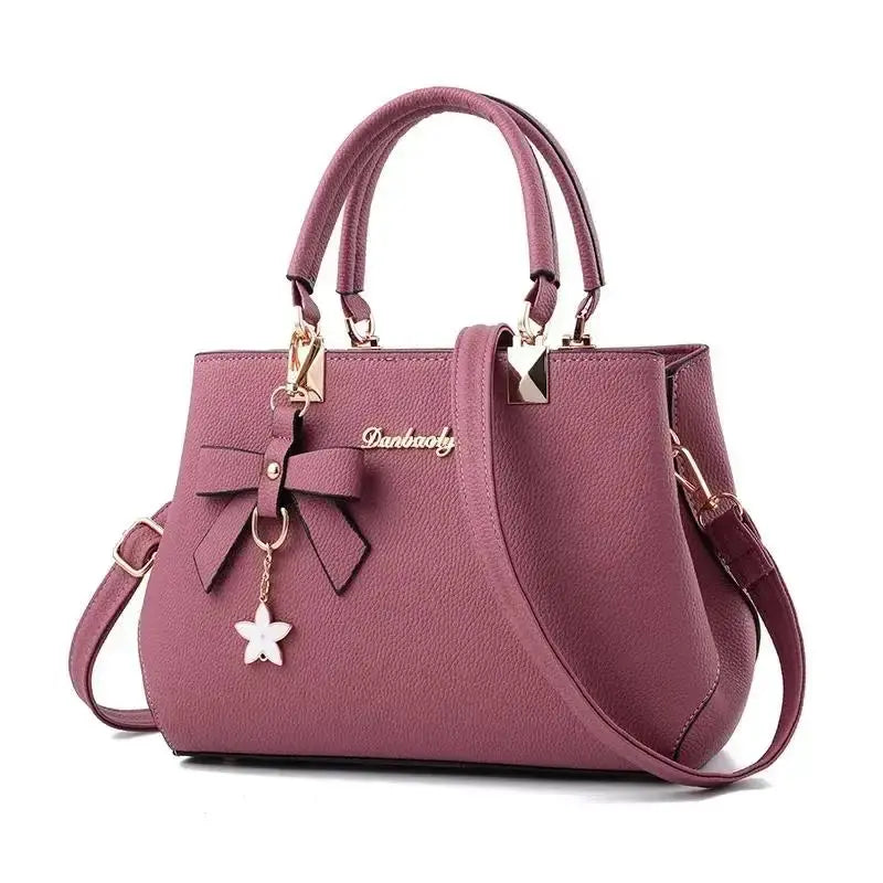 Elegant women's shoulder bag with flower pendant MAWIS