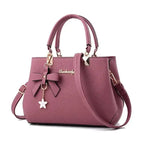 Elegant women's shoulder bag with flower pendant MAWIS