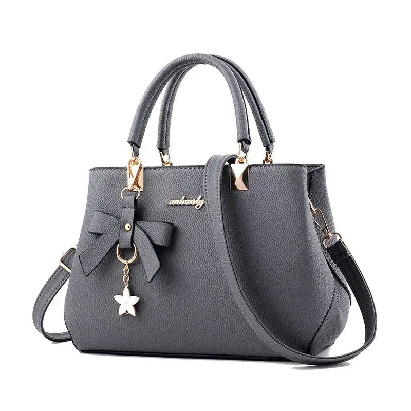 Elegant women's shoulder bag with flower pendant MAWIS