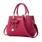 Elegant women's shoulder bag with flower pendant MAWIS